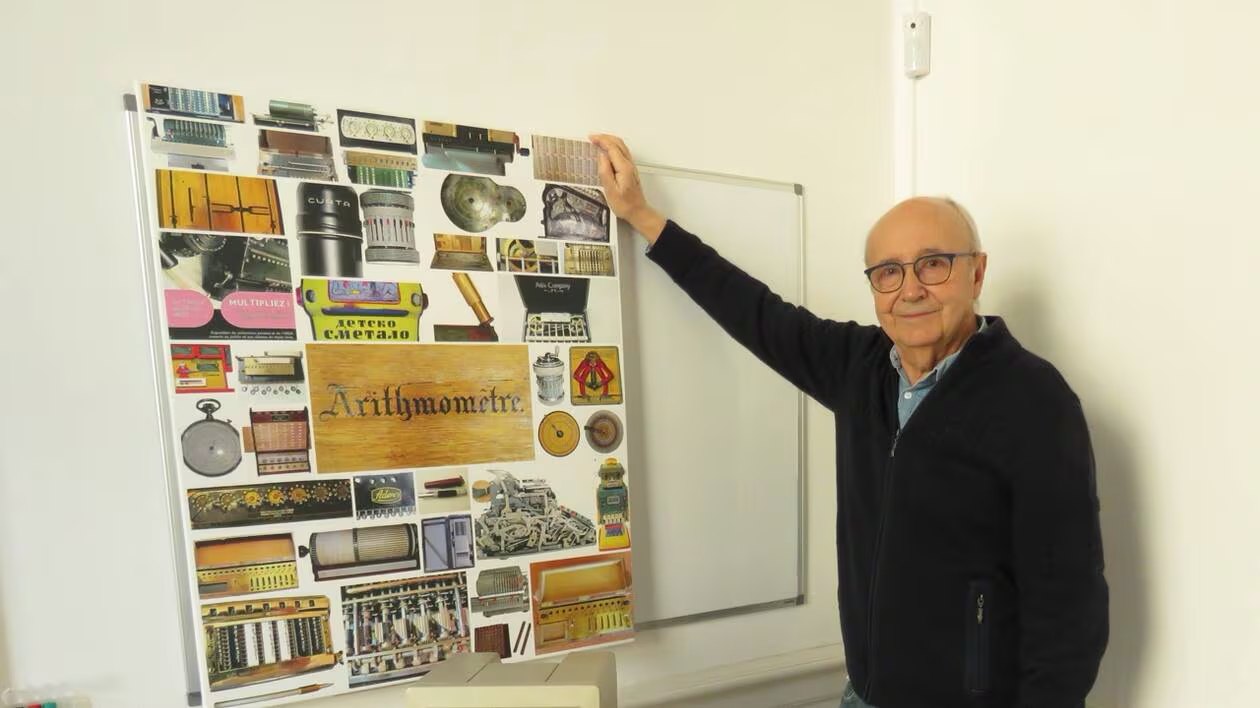 Claude Cargou presenting a poster of machines from his collection